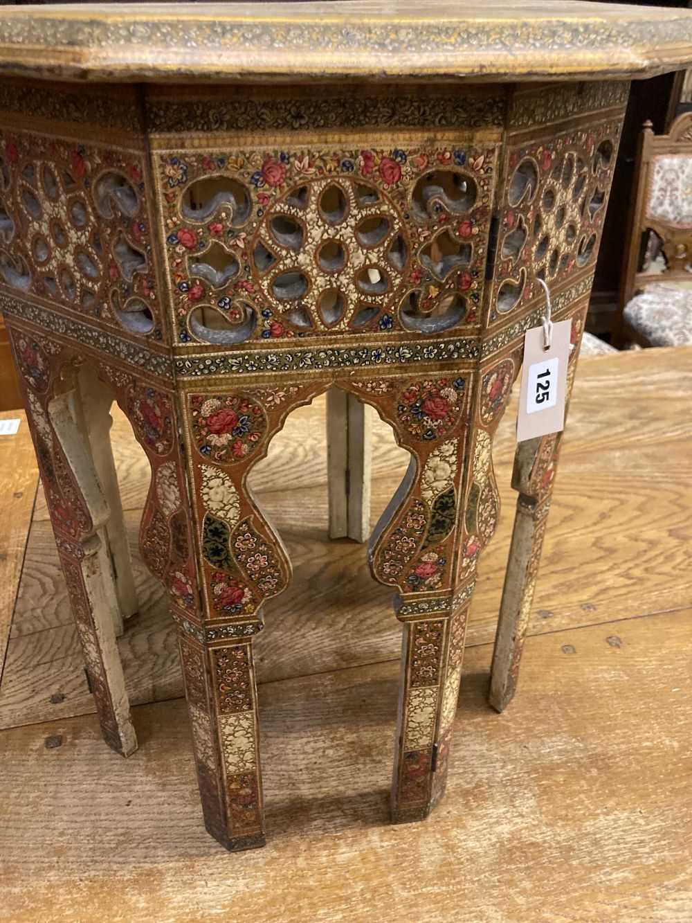 An Indian octagonal painted occasional table, width 50cm height 54cm